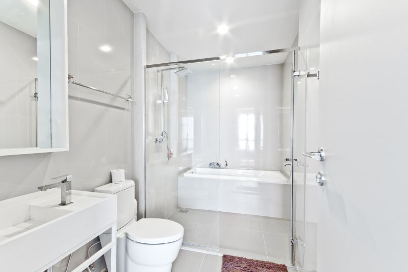 Completed bathroom with stylish tile flooring.